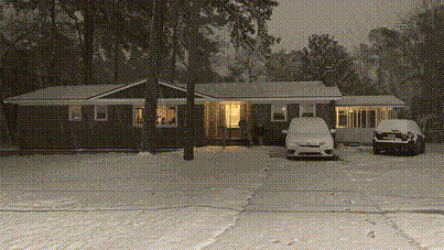 Our house covered in snow.