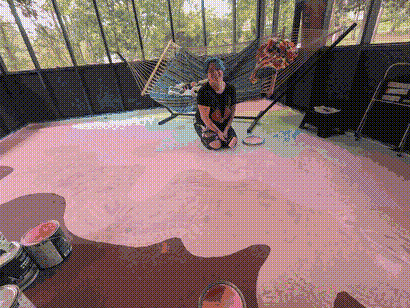 Zippi painting the porch floor.